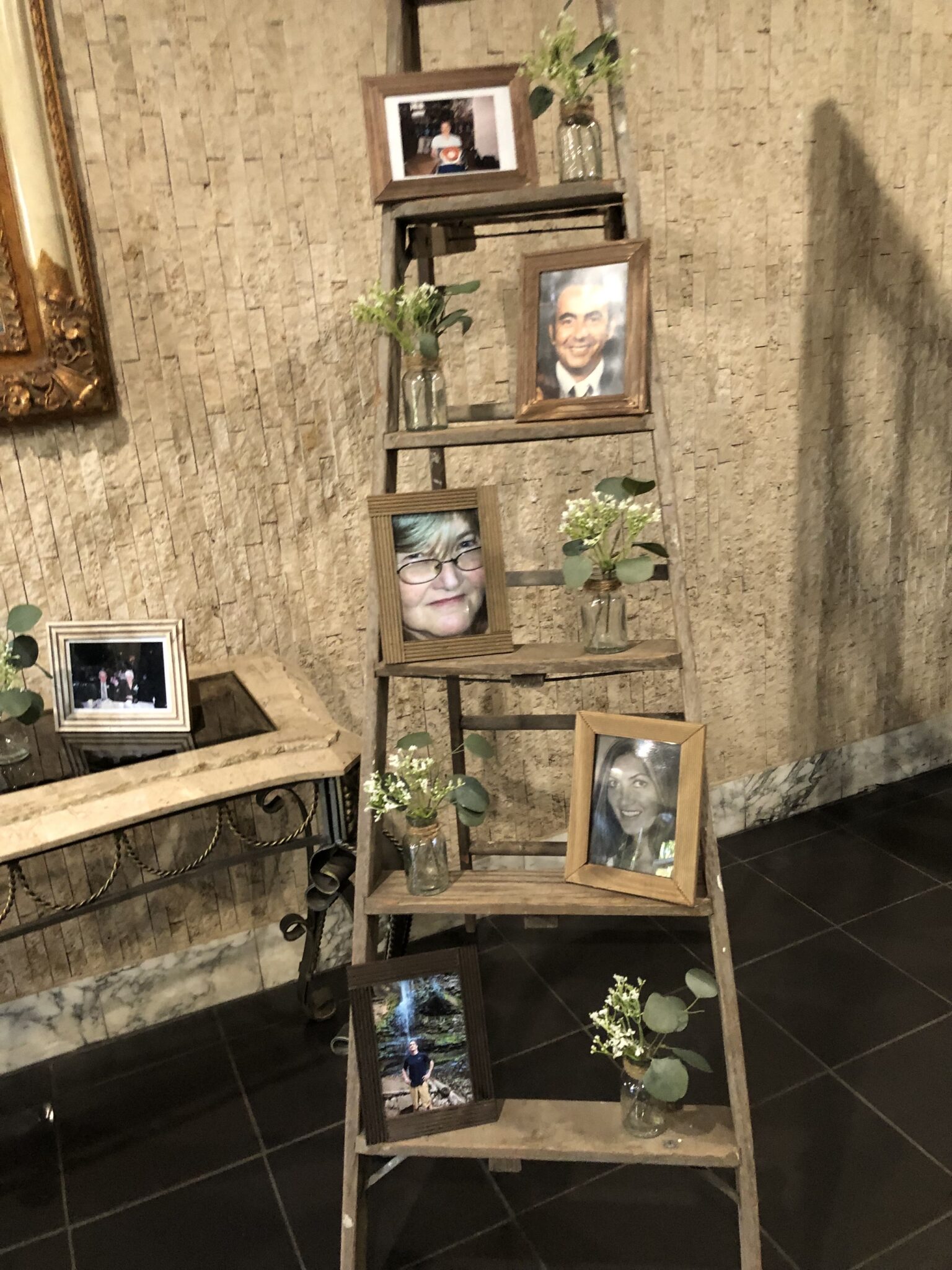 A photo memory display at a celebration of life at Everest Convention Centre
