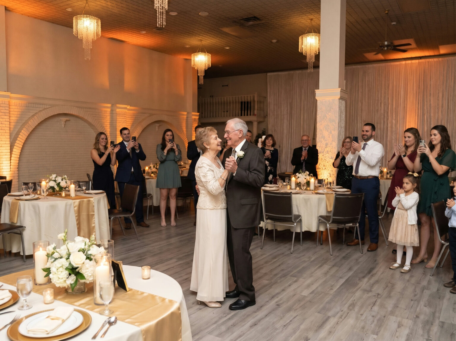 A couple celebrating their 50th anniversary with a dance surrounded by family at Everest Convention Centre