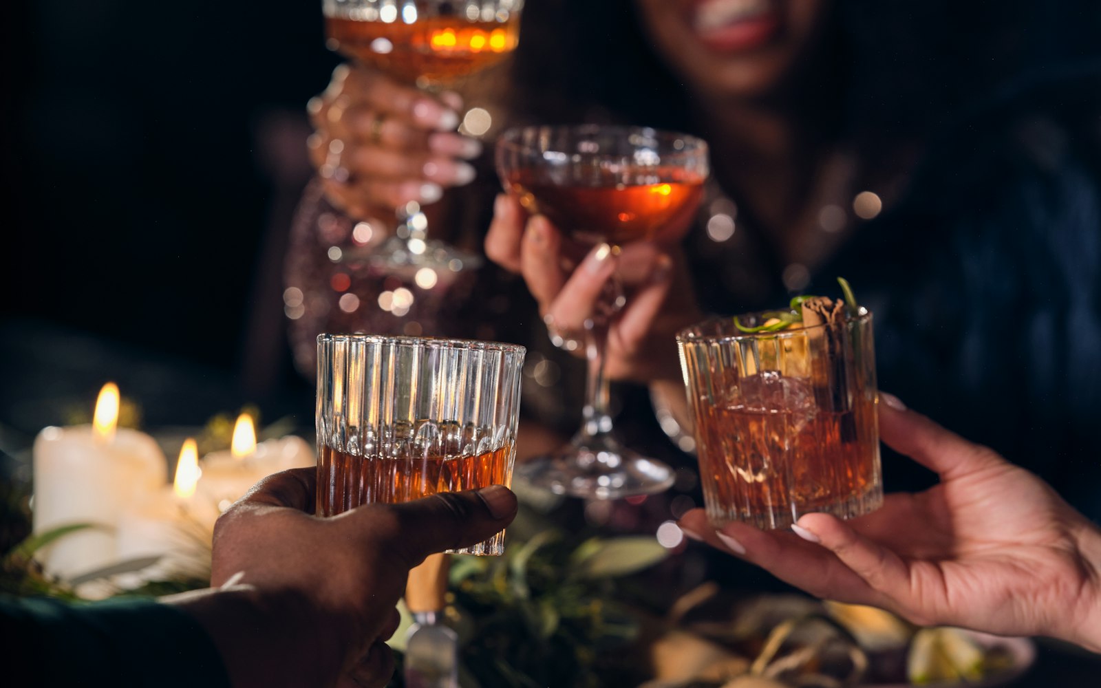 Friends and colleagues raising their glasses in a toast